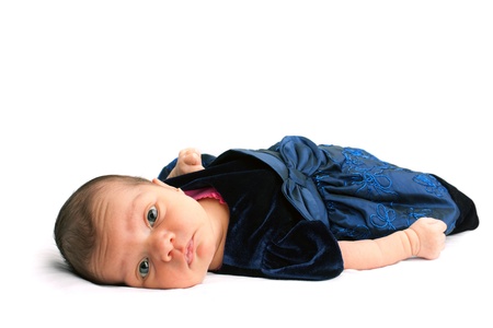 A cute newborn baby infant isolated on a white backdrop.の写真素材