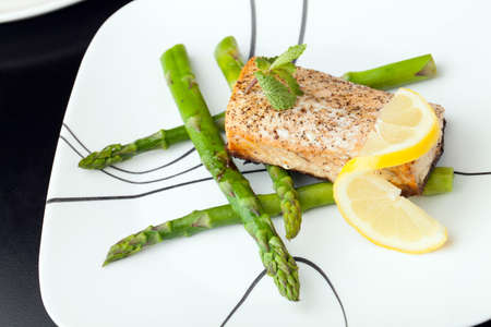 Freshly prepared salmon fish filet grilled and seasoned to perfection.の写真素材