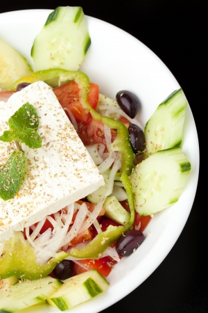 Mediterranean style or Greek garden salad with fresh goat cheese.の写真素材