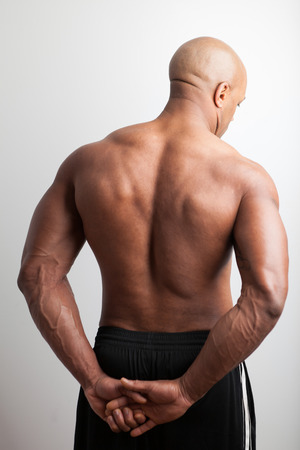Portrait of a muscle fitness mans back and shoulders.の写真素材