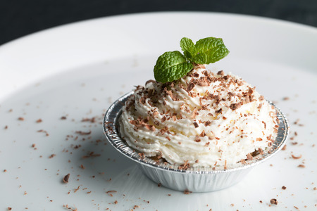Parfait dessert with fresh whipped cream and chocolate shavings. Shallow depth of field.の写真素材