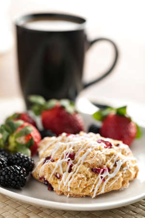 Orange Cranberry Scone with fresh fruit.  Shallow depth of field.の写真素材