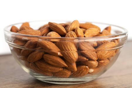 Organic almonds in raw form unroasted and unsalted.  Close up macro still life with a shallow depth of field.の写真素材