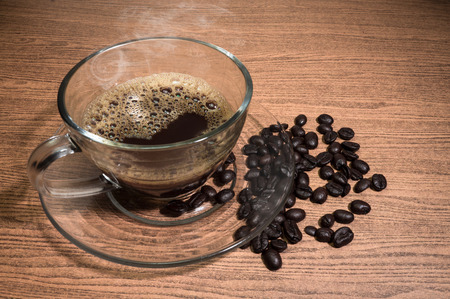Hot Coffee and cup of coffee on wood texture backgroundの写真素材