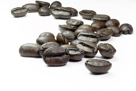 Coffee beans isolated on white background Selected focusの写真素材