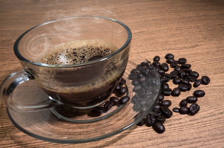 Hot Coffee and cup of coffee on wood texture backgroundの写真素材