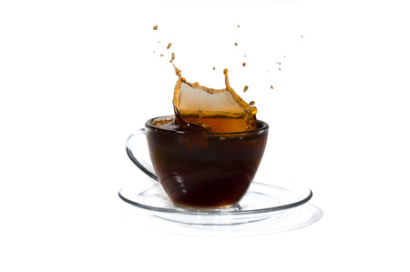 Coffee splash and cup of coffee isolated on white backgroundの写真素材