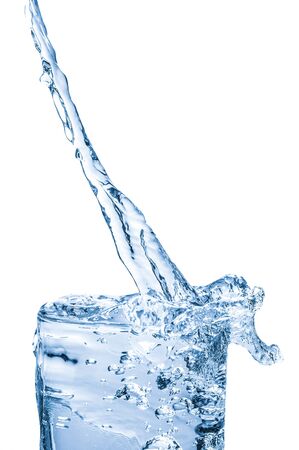 pouring water into glass, water splashing from glassの写真素材