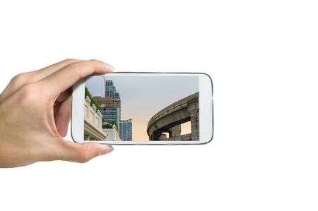 Holding a smart phone ,Take a pictureの写真素材