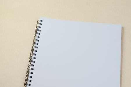 Black notepad. Realistic template notebook. Blank cover design. on cardboard background.の写真素材