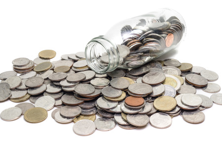 Saving money concept of collecting coins in glass bottle Isolated on white background.の写真素材