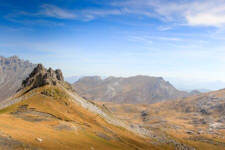 Rock Outcrop Formation and Distant View in the Picos De Europa by Fuente De Spain with Blue Skyの写真素材