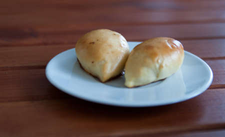 Two small pie on a wooden table