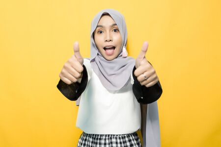 Portrait of satisfied Asian woman wearing hijabの写真素材