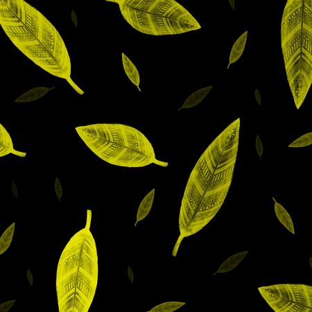 Indian yellow leaves pattern on black backgroundの写真素材