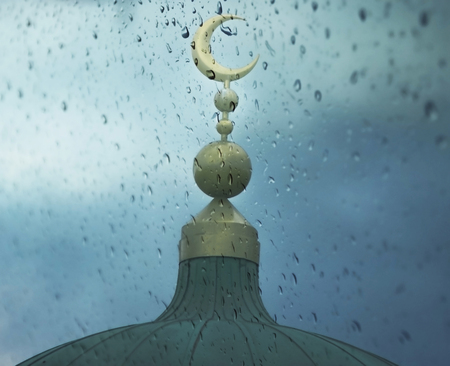 Islamic symbol on mosque in rainy weatherの写真素材