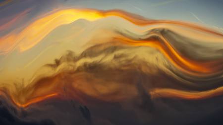 Abstract background of refracted colorful sky in sunset time with golden shadesの写真素材