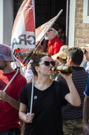Venice, Italy, 08.06.2019 Protester against cruise ships in Venice drinking beerのeditorial素材