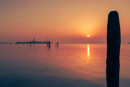 Colourful red and purple sunset over Venice lagoonの写真素材