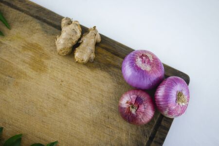 Fresh organic ingredients for cooking with onions and ginger.の写真素材