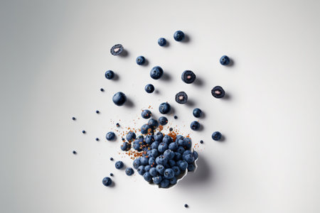 Blueberries soaring in the air against a white backdropの素材