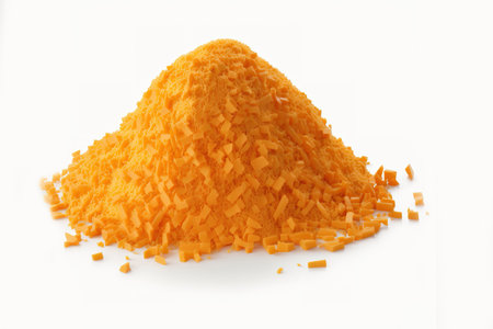 Cheddar Cheese Grated Against a White Backgroundの素材