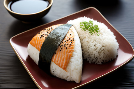 Japanese rice balls called onigiri are served with grilled salmon and sesameの素材
