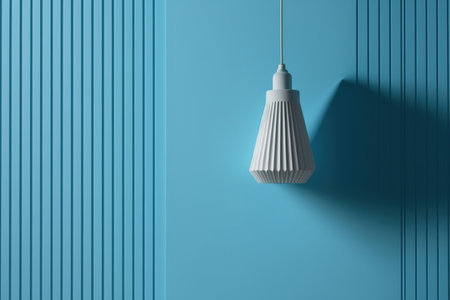 Mockup of a lamp against a blue wallの素材