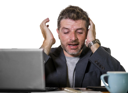 young attractive upset and stressed businessman working overwhelmed suffering stress at office...