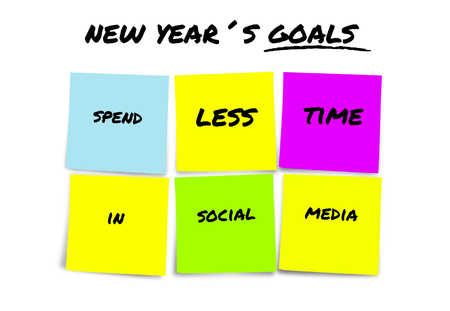 handwritten 2019 New Year goals and resolutions in colorful sticky notes determined to spend less...
