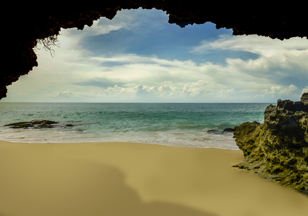 beautiful scenic view from rock cave of Asian tropical desert beach paradise in Indonesia with stunning vivid sea water color in Summer holidays travel and amazing tourist destination conceptの写真素材