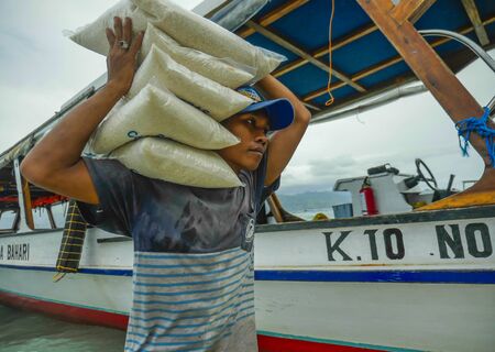 Gili Trawangan island / INDONESIA - March 8th 2019. Boats supply 24/7 all kind of stuff to...