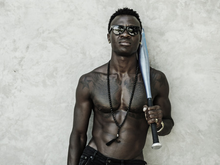 urban lifestyle portrait of young attractive and handsome black African American man with fit...