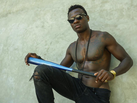 urban lifestyle portrait of young attractive and handsome black African American man with fit...