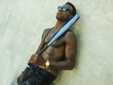 urban lifestyle portrait of young attractive and handsome black African American man with fit...