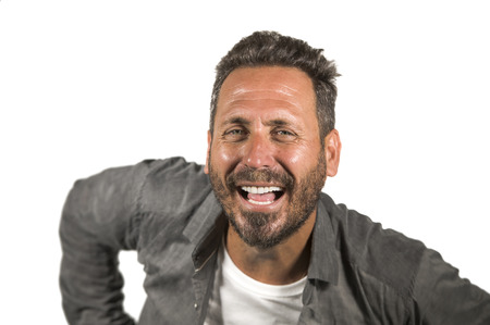 portrait of young happy and positive attractive 40s man with blue eyes and beard smiling happy and cheerful wearing casual shirt isolated on white background laughing excited and charmingの写真素材