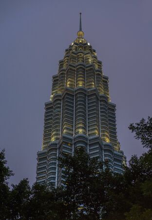 Petronas Towers KLCC, KUALA LUMPUR / Malaysia : July 2019. Blue light hour beautiful view of the...