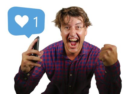 Social media addiction and obsession . funny portrait of young crazy happy and excited man...