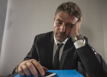 exhausted financial executive man suffering stress - corporate business lifestyle portrait of stressed and tired businessman working frustrated having problem feeling upset and overworkedの写真素材