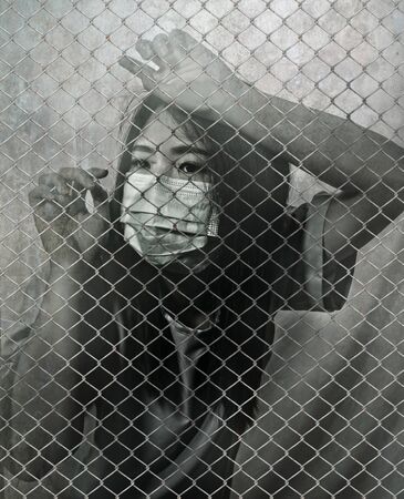 black and white  portrait of young Asian Chinese woman infected victim of contagious virus or...