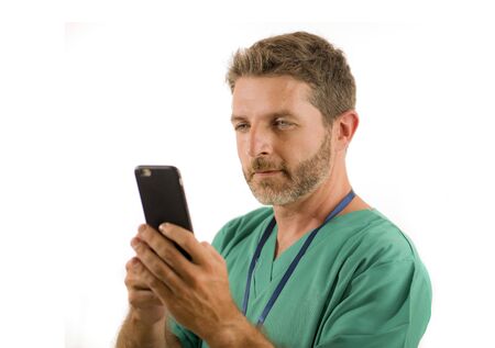 young attractive and successful medicine doctor or nurse man posing confident  in green medical...