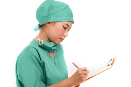 young attractive and efficient Asian   medicine doctor woman or hospital nurse in protective face mask and green gown isolated on white background during covid-19 virus crisisの写真素材