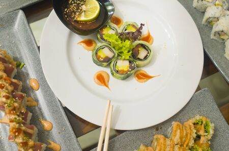 delicious and delicate assorted Japanese sushi rolls on beautiful set up on table in traditional healthy Asian food and creative oriental dining concept - Japan gourmet cuisine tasting menuの写真素材