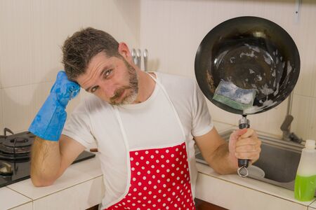 domestic chores stress - lifestyle portrait of young attractive overworked and stressed home cook...