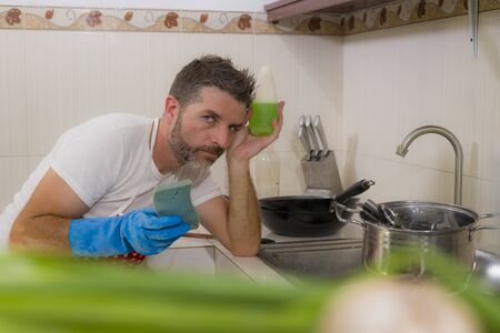 domestic chores stress - lifestyle portrait of young attractive overworked and stressed home cook...