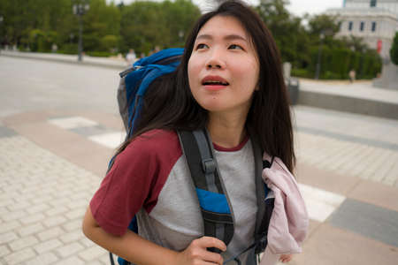 young Asian woman visiting Europe in holidays as backpacker touristの写真素材
