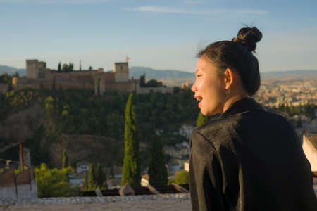lifestyle portrait of young beautiful and happy Asian Japanese tourist woman having Summer holidays...