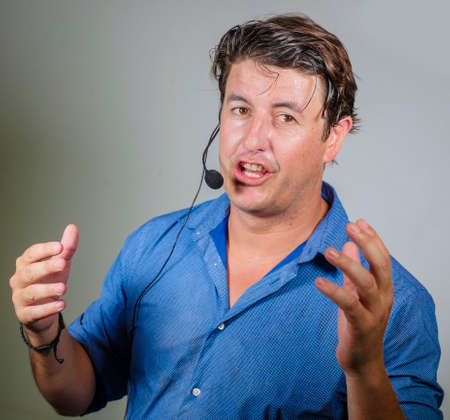 young attractive and successful man giving motivation coaching speech talking through headset...