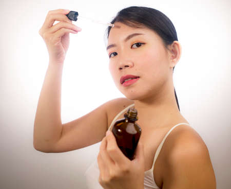 self care and beauty treatment - young beautiful and relaxed Asian Korean woman on the mirror...