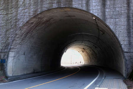 Interior of  tunnel.view of the road through the tunnel with the rayの写真素材